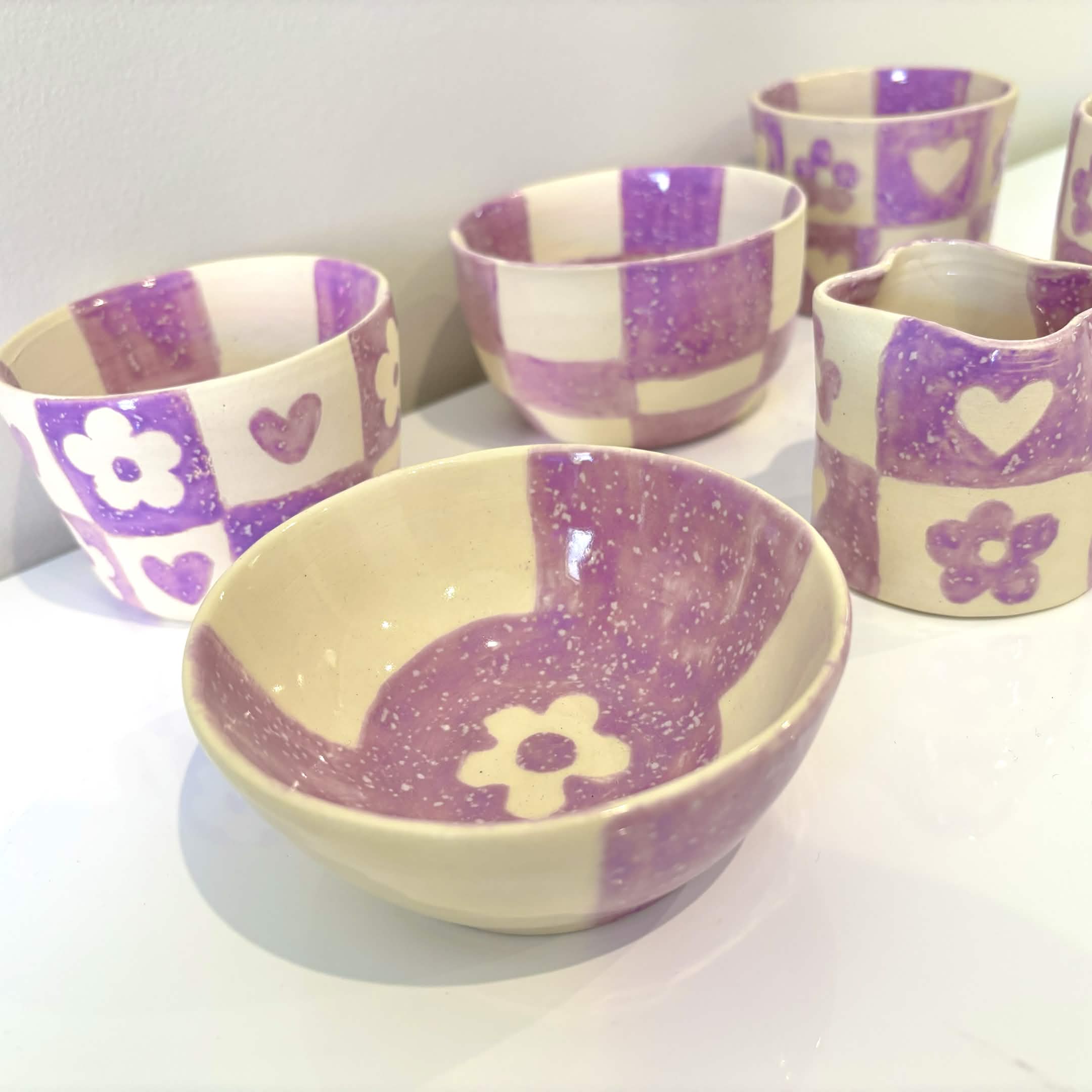 Purple flower patterned handmade ceramic bowls